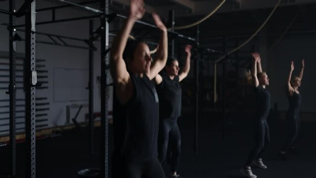 Group Aerobic Class For Women In Fitness Club, Young Adult Ladies Jumping In Gym, Female Athletes