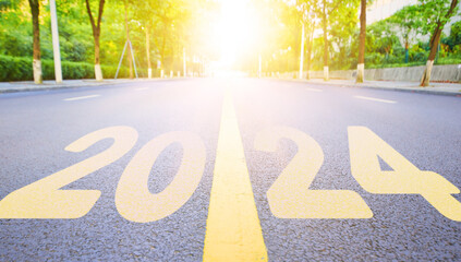 The straight highway surface is written with 2024.