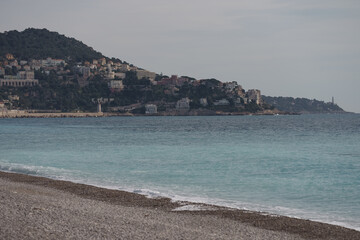 Morning waves on pebble beach in Nice, France