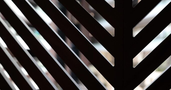 Sun shines through window wooden blinds. Wooden strips on window and bright light