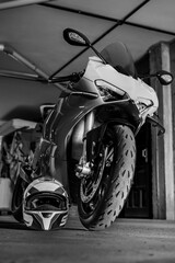 Sport Motorbike in a Garage by a Helmet 