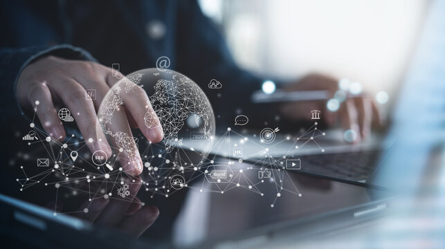 Digital marketing, global business, E-commerce, IoT Internet of Things. Businessman using computer with social media marketing icons and global internet network connection, Business plan and strategy