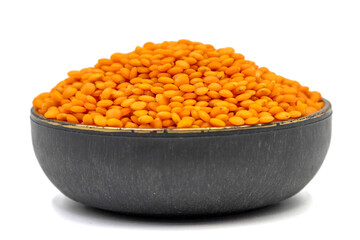 Red lentils isolated on white background. Raw red lentils in bowl. Close up