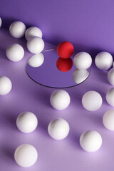 dimensional compositions of geometric shapes concept.white and crimson balls on mirror on purple background. copy space. abstract wallpaper style