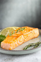Grilled salmon with spices on the plate.