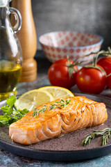 Grilled salmon with spices on the plate.
