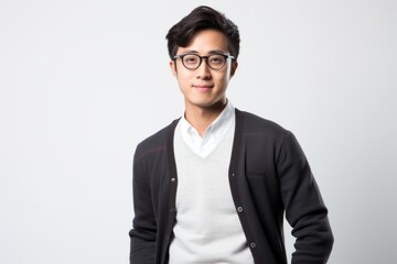 Fototapeta premium Young asian man wearing eyeglasses standing on white background.