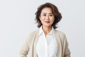 Obraz premium Portrait of a smiling businesswoman isolated on a white background.