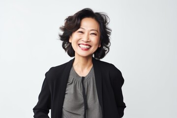 Portrait of a beautiful asian businesswoman smiling isolated on a white background