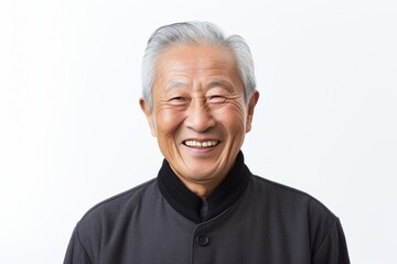 Portrait of happy senior asian man laughing and looking at camera