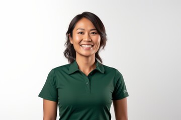 Portrait photography of a pleased Indonesian woman in her 30s wearing a sporty polo shirt against a white background 