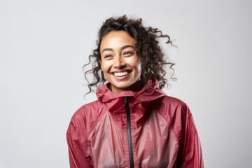 Portrait of a smiling afro american woman in raincoat