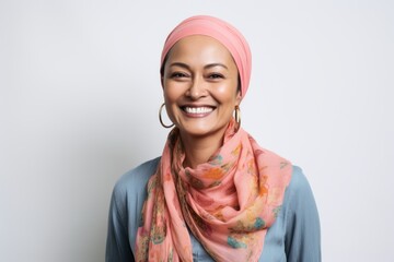 Portrait of a smiling young muslim woman wearing headscarf