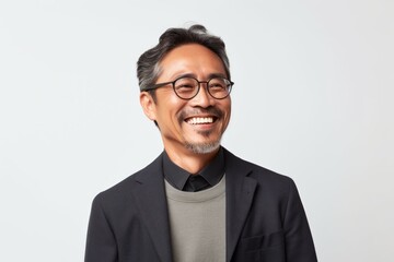 Portrait of a cheerful asian man in eyeglasses.