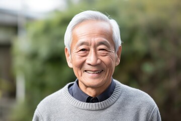 Portrait of happy asian senior man smiling and looking at camera
