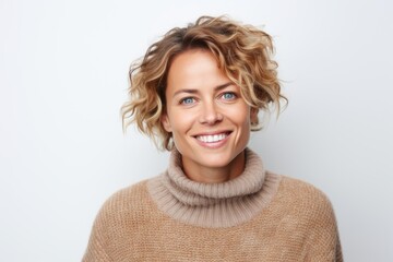 Portrait of a beautiful young woman with blond curly hair smiling at camera