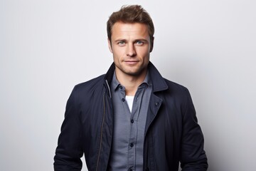 Fototapeta premium Portrait of handsome young man in casual clothes looking at camera.