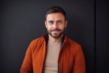 Fototapeta premium Medium shot portrait photography of a satisfied Russian man in his 30s wearing a chic cardigan against an abstract background 