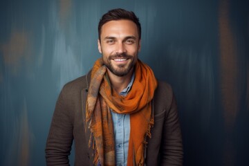 Obraz premium Portrait photography of a pleased Russian man in his 30s wearing a charming scarf against an abstract background 