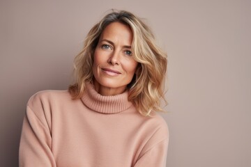 Medium shot portrait photography of a satisfied Russian woman in her 40s wearing a cozy sweater against an abstract background 