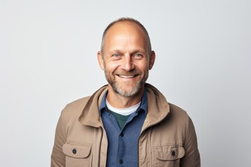 Fototapeta premium Portrait of a smiling middle-aged man in a jacket.