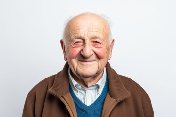 Obraz premium Portrait of a senior man with wrinkles on his face on a white background