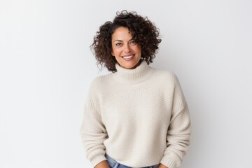 Portrait of smiling woman with curly hair looking at camera over white background