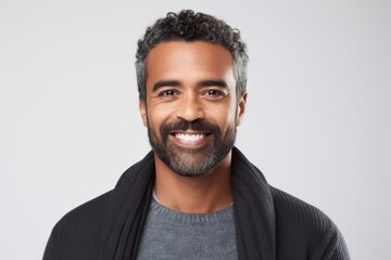Portrait of a smiling young man with beard isolated on a white background