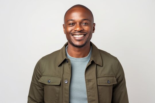 Portrait of a handsome african american man smiling against white background