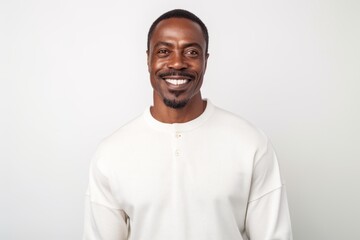 Fototapeta premium Portrait of a smiling african american man in white sweatshirt