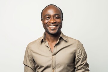 Obraz premium Portrait of a smiling african american man on a white background