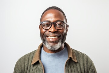Fototapeta premium Portrait of a smiling african american man wearing glasses and a sweater