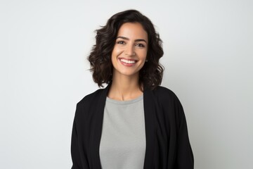 Obraz premium Portrait of a beautiful young woman smiling at camera over white background