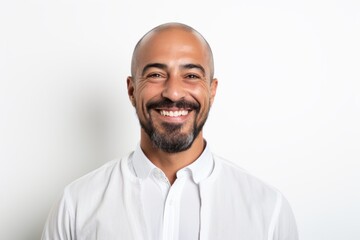 Portrait of a handsome bald man in a white shirt on a white background