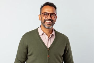 Portrait of a happy indian man in eyeglasses on white background