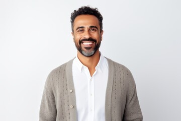 Obraz premium Portrait of a handsome young man smiling and looking at camera over white background