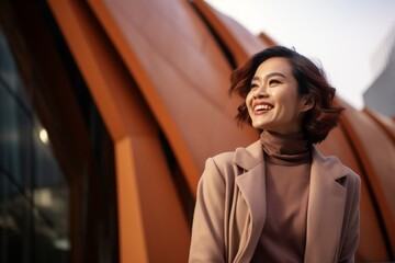 Portrait of a beautiful young asian woman in urban background.