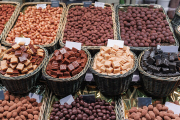 Black and White Chocolates Arranged Inside Wicker Baskets