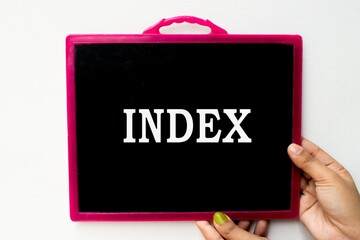 Index text or word written on blackboard or  black chalkboard held with hand in white background.
