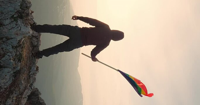 LGBTQ community. A man proudly stands with a vibrant rainbow flag, symbolizing love, acceptance and equality. A powerful visual representation of fight for LGBTQ rights