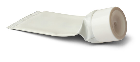 close-up of used empty tube with white cap, mock-up template for toothpaste, cream, gel or shampoo, blank package isolated on white background, medicine or cosmetics concept