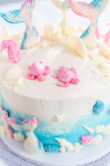 Fototapeta na wymiar Mermaid themed 3 layer vanilla cake