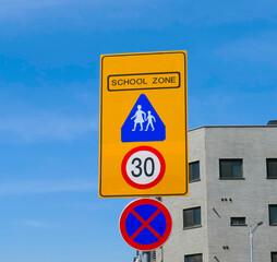 school zone sign on the street 