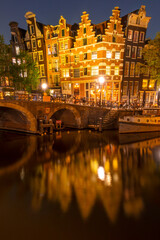 Dancing Dutch Houses on Amsterdam Canal at Night
