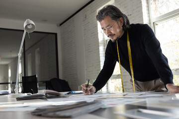 Authoritative fashion designers draw design drafts