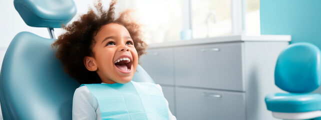 An African-American child sitting in a dental clinic chair with their mouth open, waiting for the dentist to perform an oral inspection