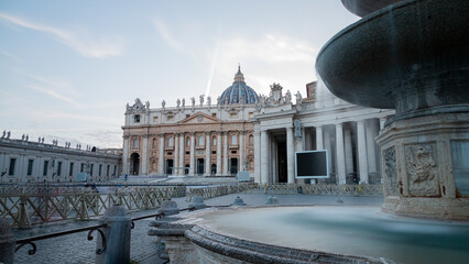 Vatican City, St. Peter's Square seen from the fountain without people.