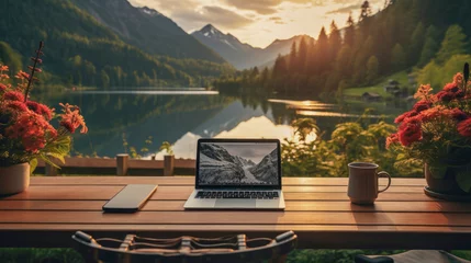 Fototapete Alpen outdoor workspace desktop at Bavaria, Germany with laptop and coffee cup. 