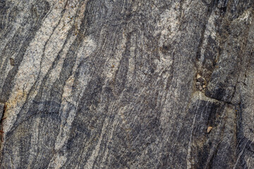 Background close-up rocky gray stone marble
