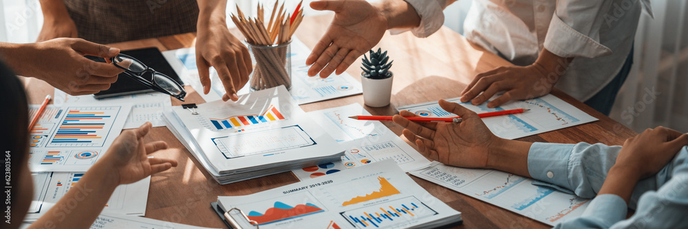 Leinwandbilder analyst team utilizing bi fintech to analyze and pointing at financial dashboard paper office. busin